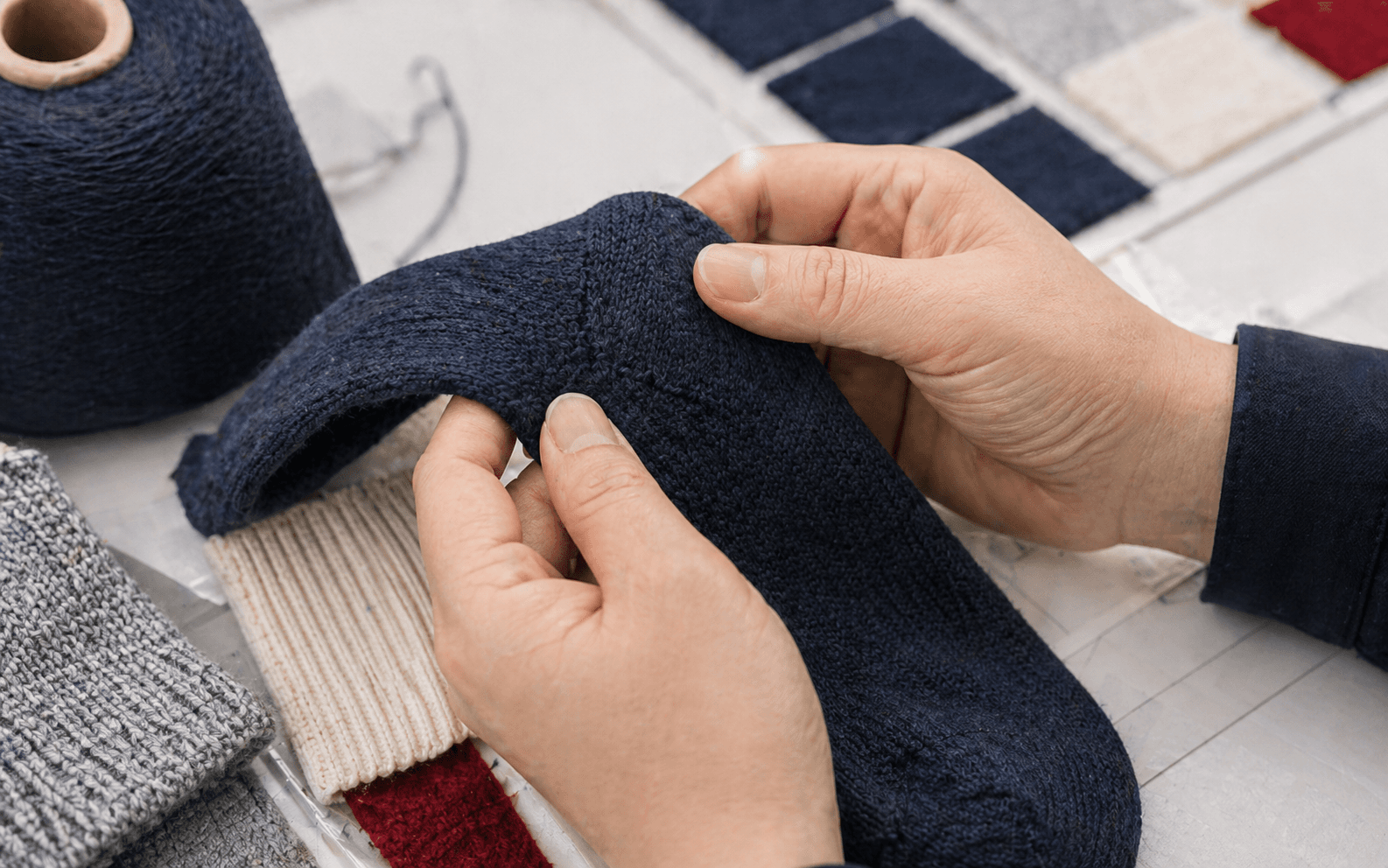 Close inspection scene for a functional sock program with material and quality-review context