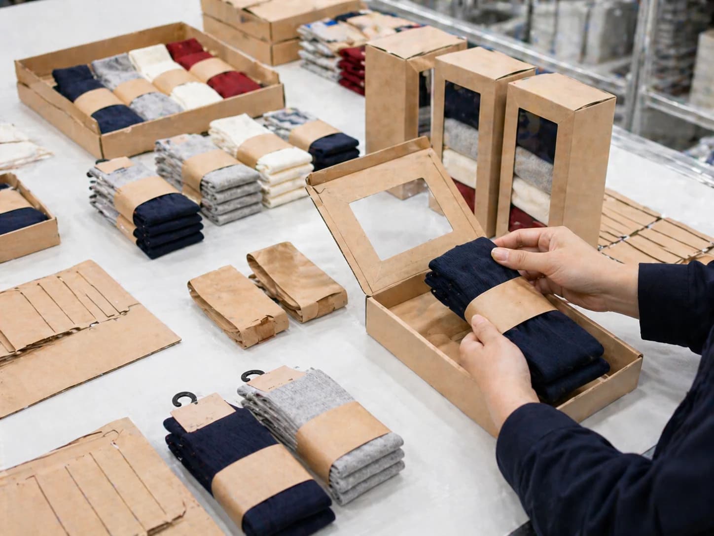 Retail sock packaging examples including sleeve wraps, hang tags, and presentation boxes